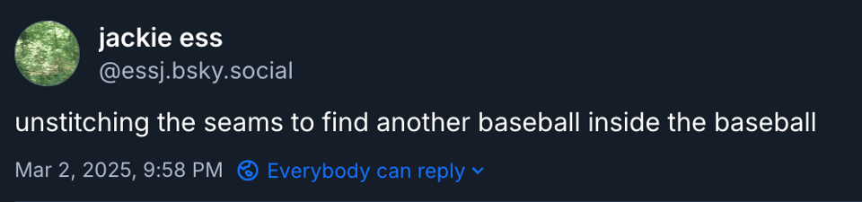 unstitching the seams to find another baseball inside the baseball