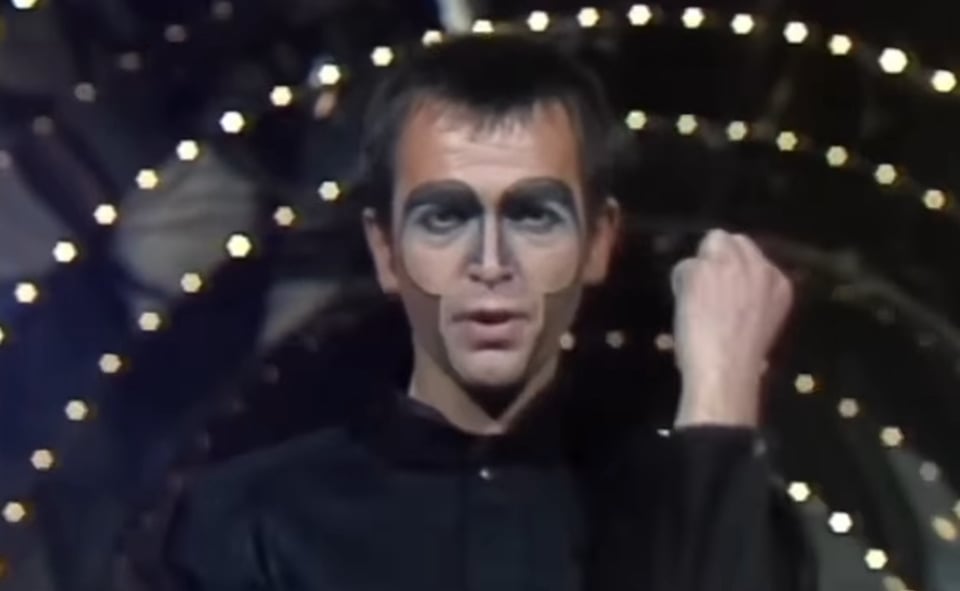 video still of Peter Gabriel in Shock the Monkey facepaint