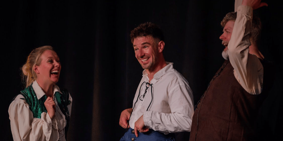 The cast of The Play's The Thing have a lovely laugh on stage.