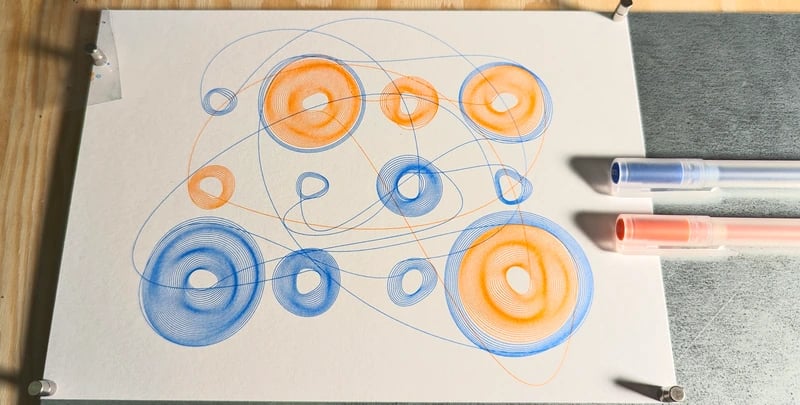 A pen plotted design with two colors: a bright orange and a saturated blue. There is an invisible grid of 4 columns and 3 rows. The line spirals out around one of the cells until after a number of turns it switches to another cell, like an obssesive bee flying around a flower until it switches to another flower. The curve is distorted with simplex noise to avoid a perfect spiral (giving it a subtle 3D look).