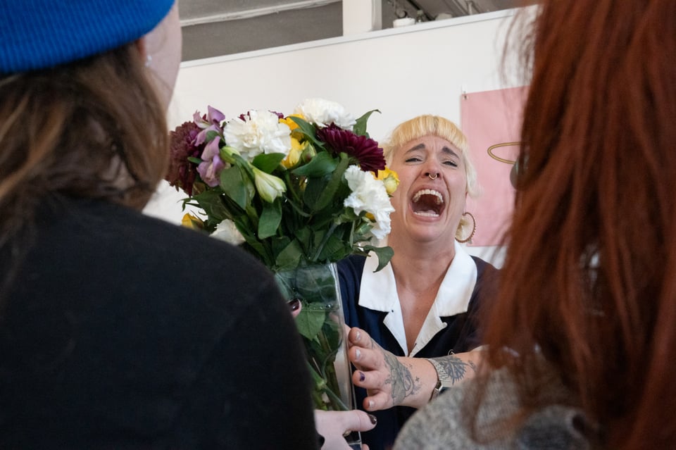 Beth graciously receiving flowers.
