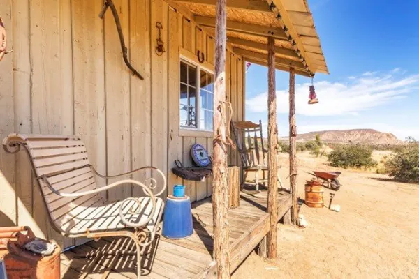a typical wild west homestead wtih veranda