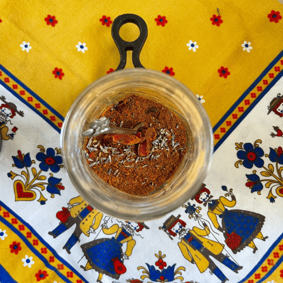 a jar of ground pepper, cinnamon, lavender.