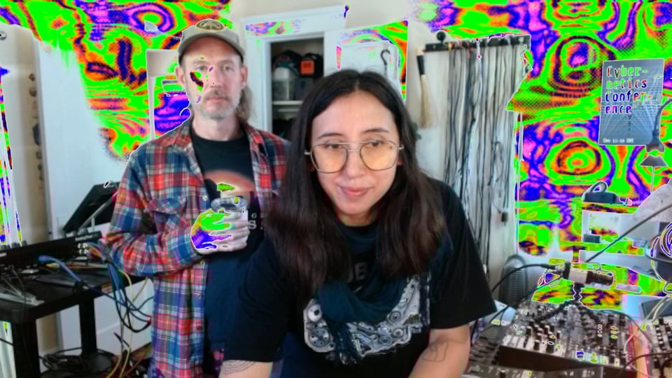 two people and musical instruments and analog video patterns