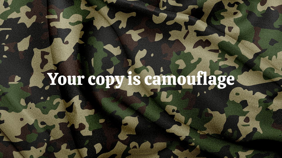 White text over a photograph of army camouflage fabric, which says, "Your copy is camouflage"