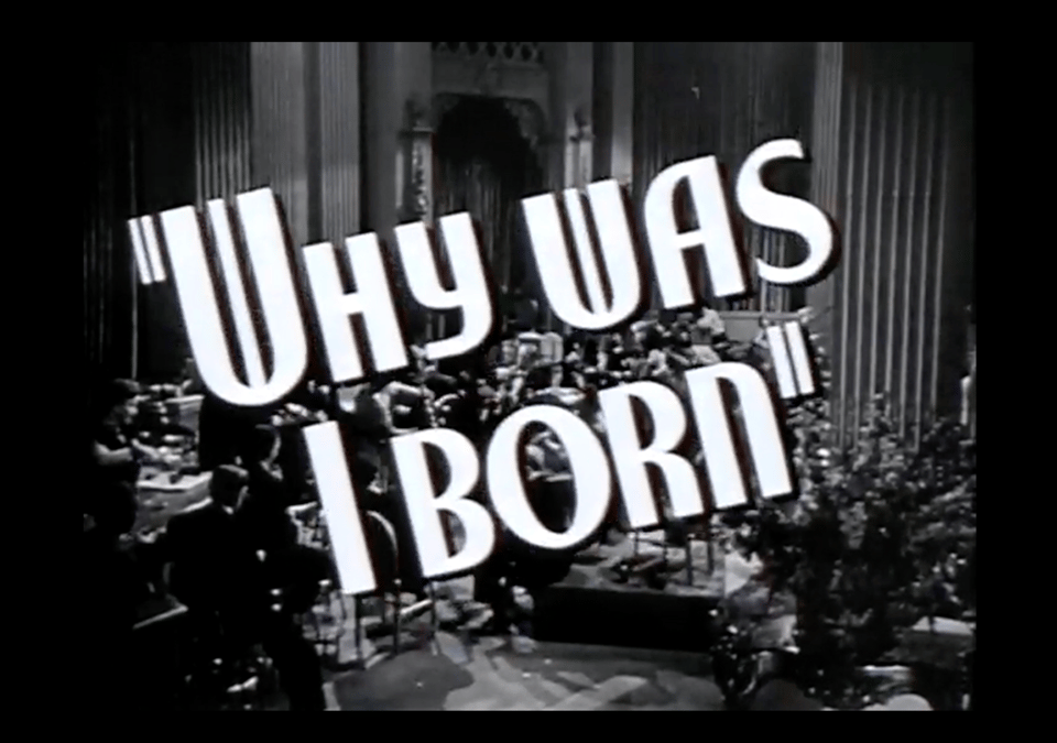 A still from a 1947 trailer for "The Man I Love"--it's from a sequence listing songs in the film. The words "Why was I born" in a real Jazz Age-y font appears at a tilt in foreground with a black and white image of a jazz band in the background