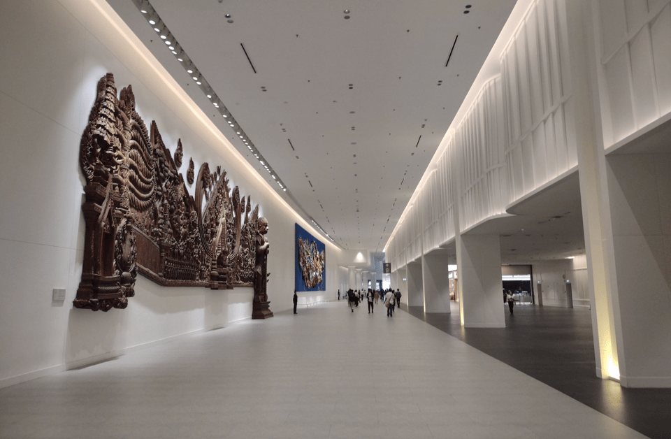 Full-wall Thai wooden sculpture by the pathway inside the Queen Sirikit National Convention Center Bangkok