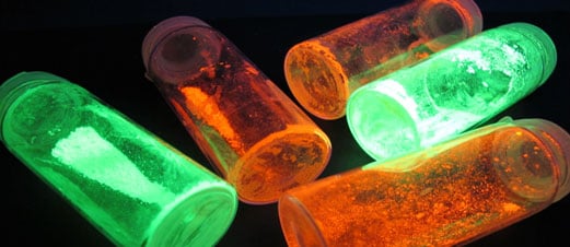 glowing tubes of luminescent lanthanide elements at the University of Ghent's luminescent lanthanide lab