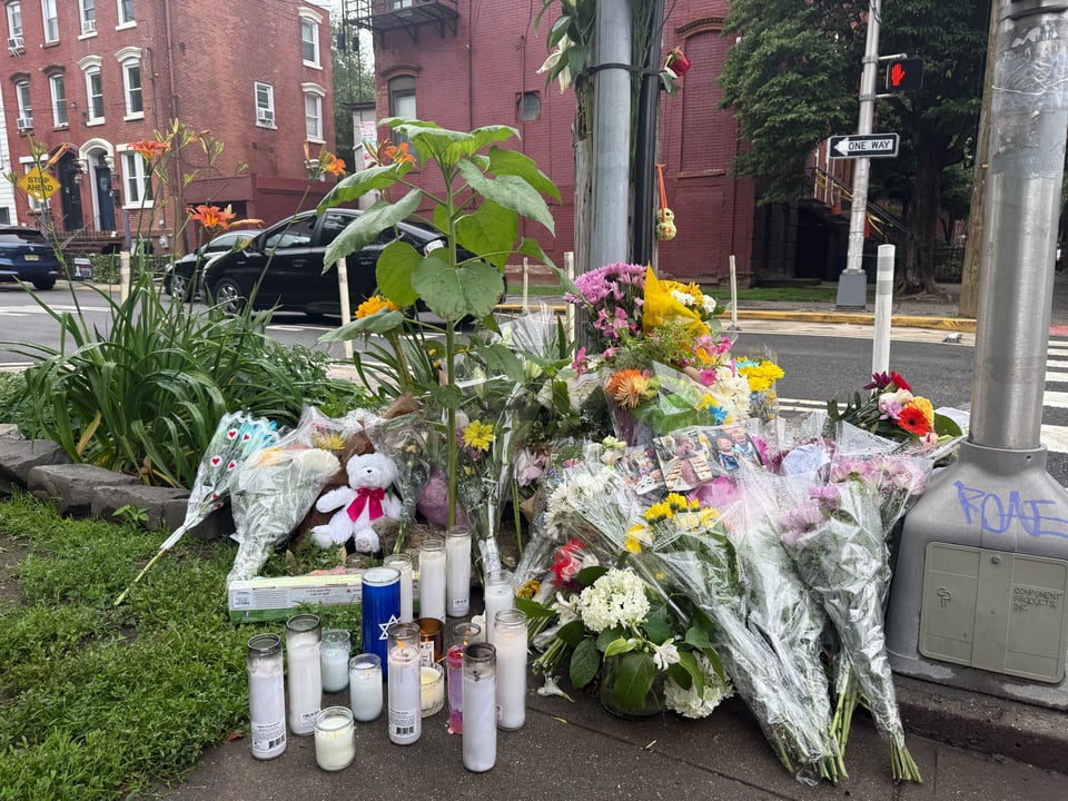 flowers and candles at the vigil