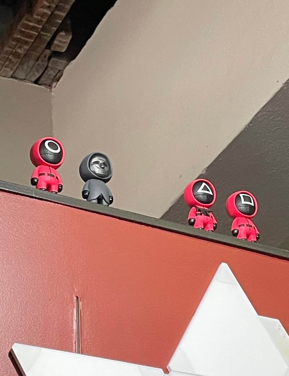 Squid game figures on a shelf