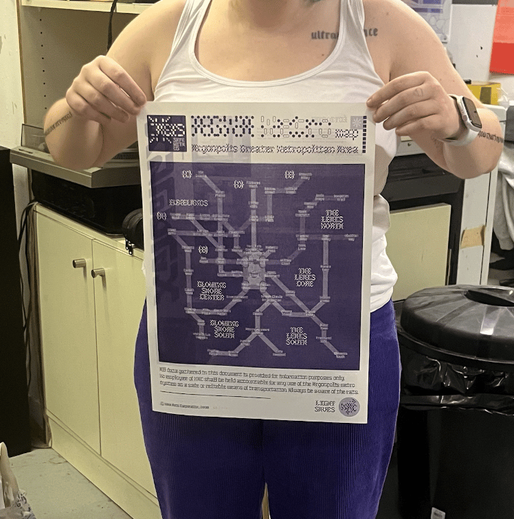 Me holding the purple Xyloplast gazette, dressed in the same shades as the print