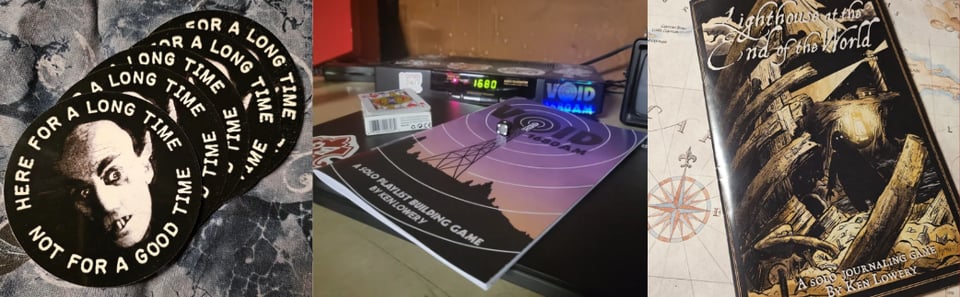 Stickers saying "here for a long time, not for a good time," and physical copies of VOID 1680 AM and Lighthouse at the End of the World.