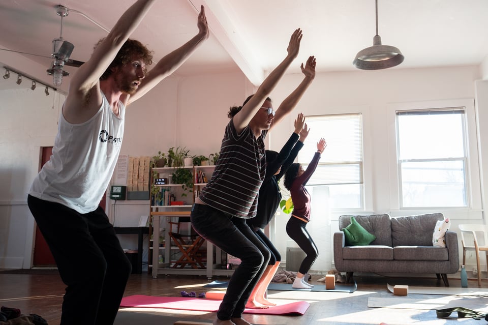People doing yoga.