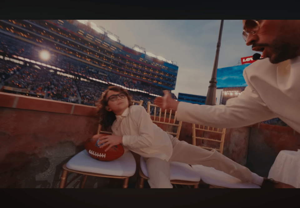 Bad Bunny wakes up a kid sleeping at the wedding celebration during Baile Inolvidable.