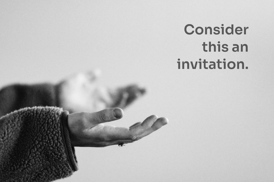 A person holding up their hands; text 'Consider this an invitation'