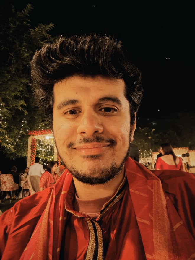 Photo of Ratik at a wedding, wearing a traditional Indian outfit (Kurta).