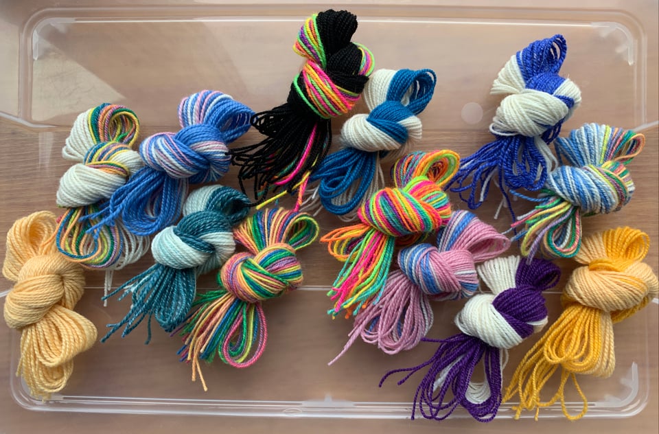 a variety of colorful tzitzit string sets.