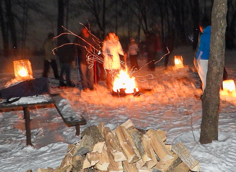 Hikers warmed up at a bonfire during last year’s CandleNight walk. Join us for this year’s Feb. 8 event, held on the Saturday closest to that month’s Feb. 12 full moon. / Photo by Steve Dietz
