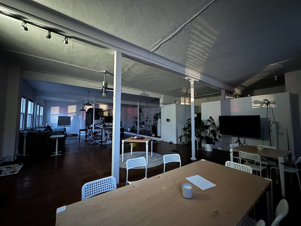 The Company, empty, at night, with shadows on the walls and ceiling.