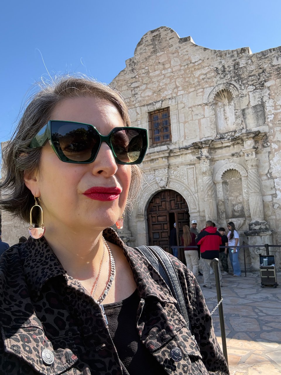 woman in front of the Alamo