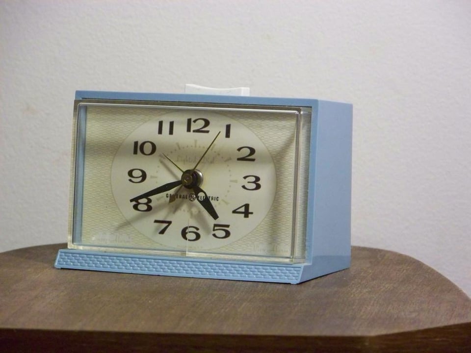Blue alarm clock on a table