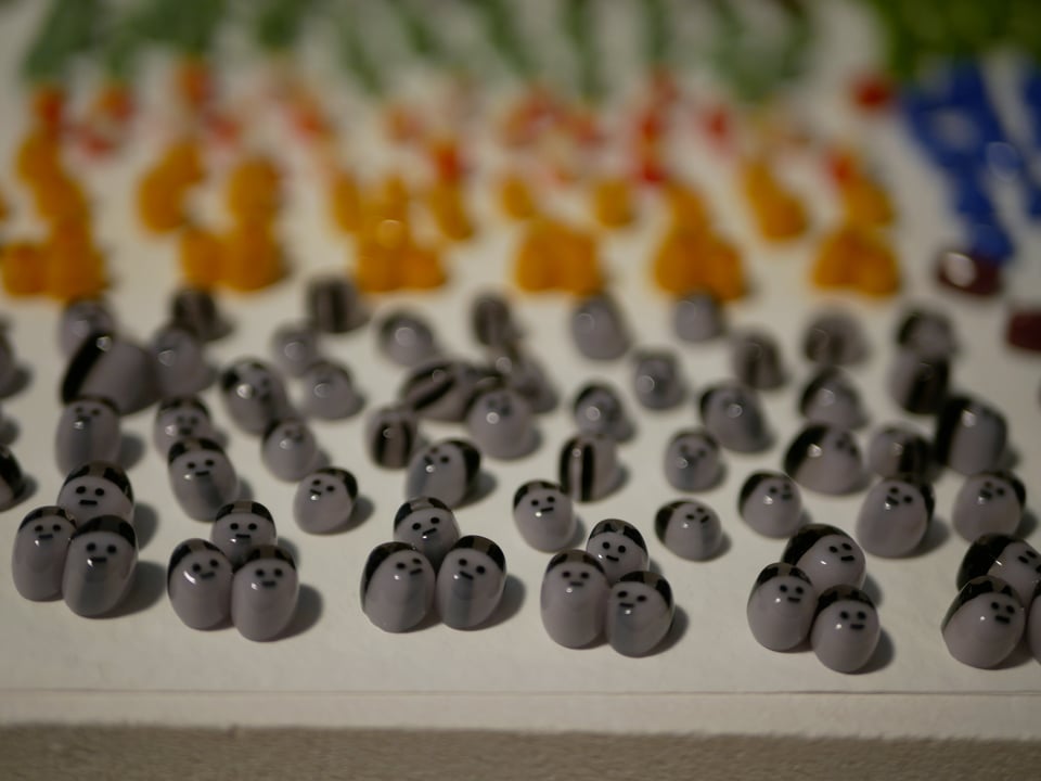 kiln shelf with blobs that have little faces