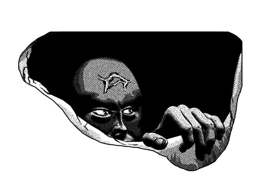 a man looking out of a hole