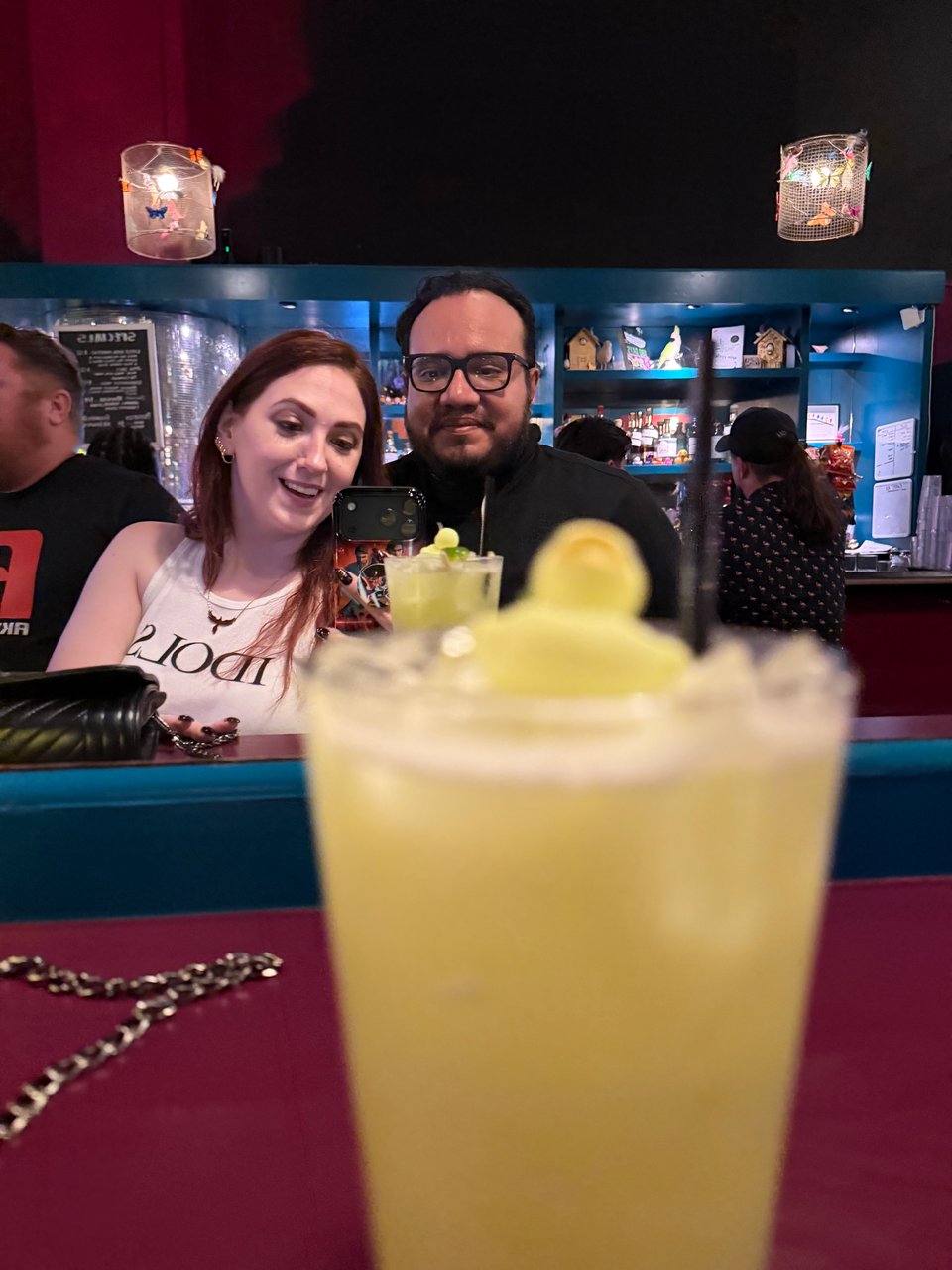 Crystal and Henry taking a picture with a ducky drink somewhere in downtown Oakland.