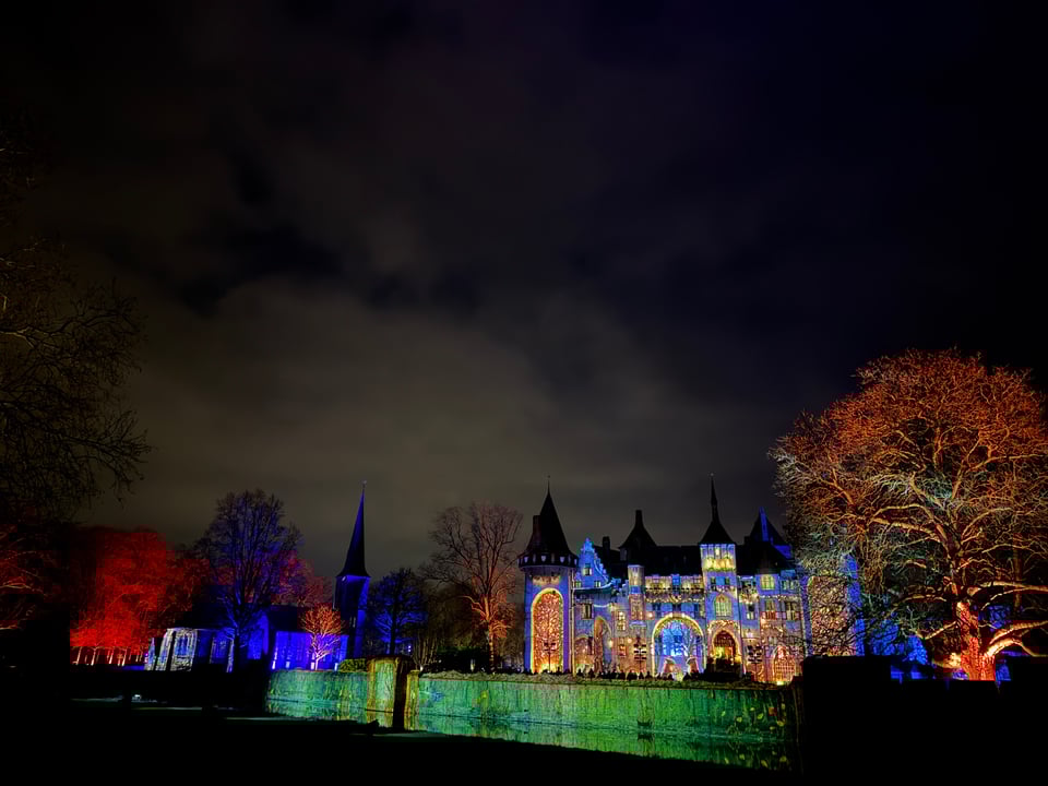A nightscape of lights over a castle.