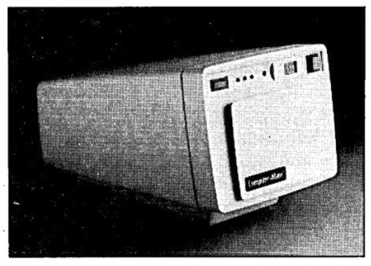 A sidelong photograph of Computer-Mate's Video Printer, which looks to be fully enclosed and self-contained. There is no visible camera device.