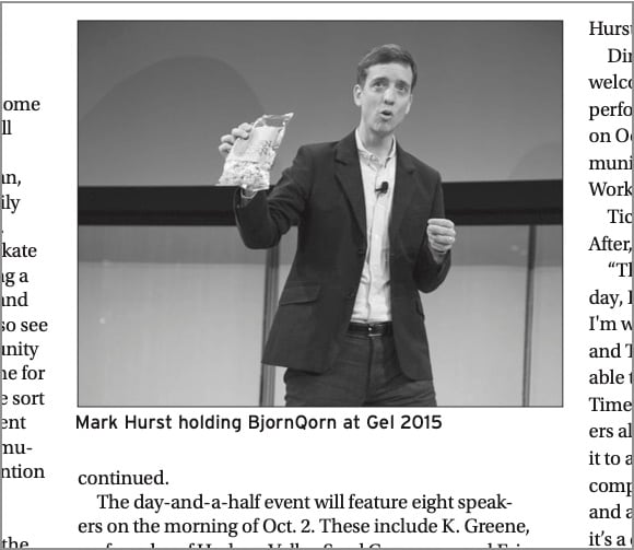 Photo of Mark Hurst gesturing with a bag of popcorn in his hand, surrounded by text from the newspaper article. Below the photo, the caption: "Mark Hurst holding BjornQorn at Gel 2015"