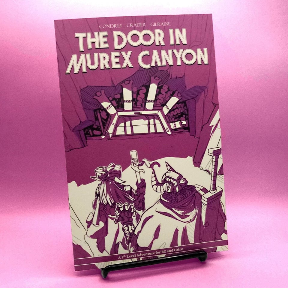 A staplebound booklet on a display case. Massive text reads The Door in Murex Canyon credited to Condrey, Crader, and Gilraine. The cover art depicte a mechanical warrior with a sword and an elf standing in front of a semi organic looking mechanical door in the side of a canyon wall
