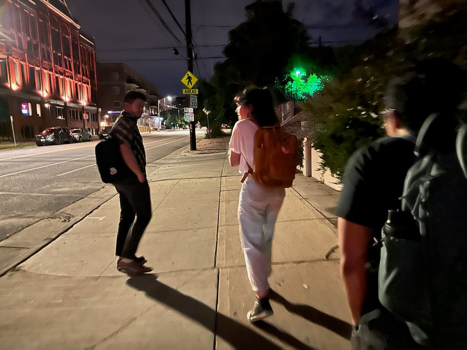 People walking at night.