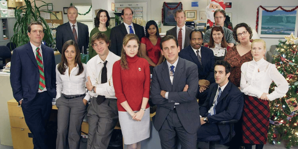 The entire cast of the US Office pose for the camera.