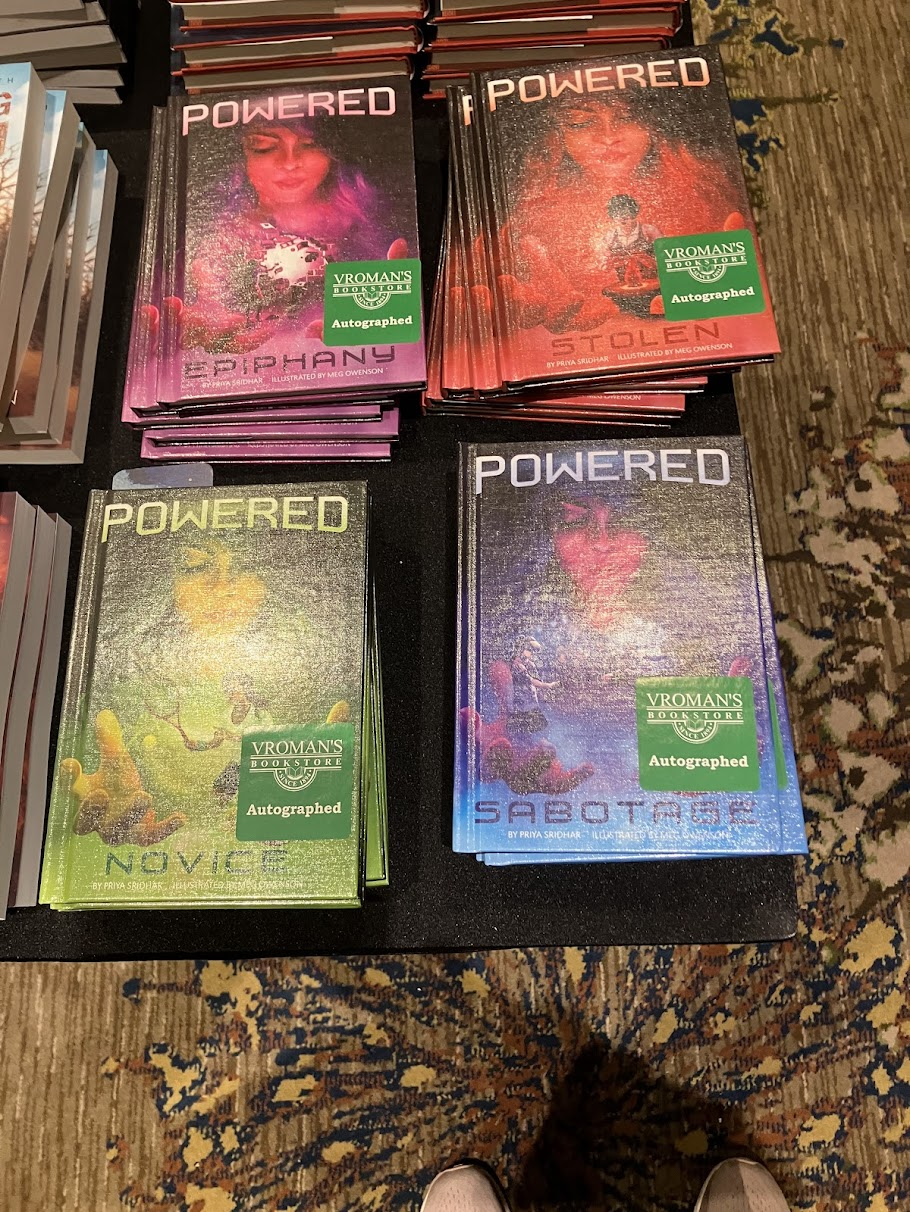 Signed copies of the Powered series by Priya Sridhar (me) at the Nebulas pop-up Vromans bookstore..