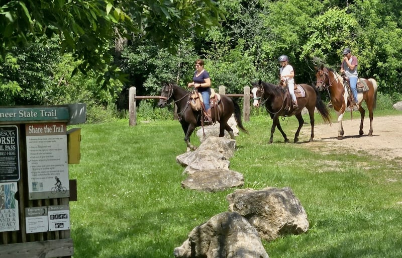 Horses and riders emerged from the Cross Country Trail in the Hay Creek Unit on a steamy day in July. / Photo by Pamela Miller