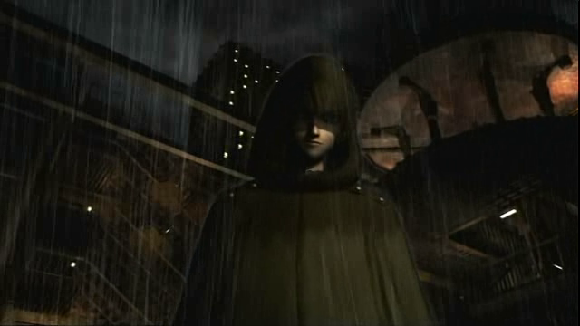 A figure standing in the rain on a dark night in the city