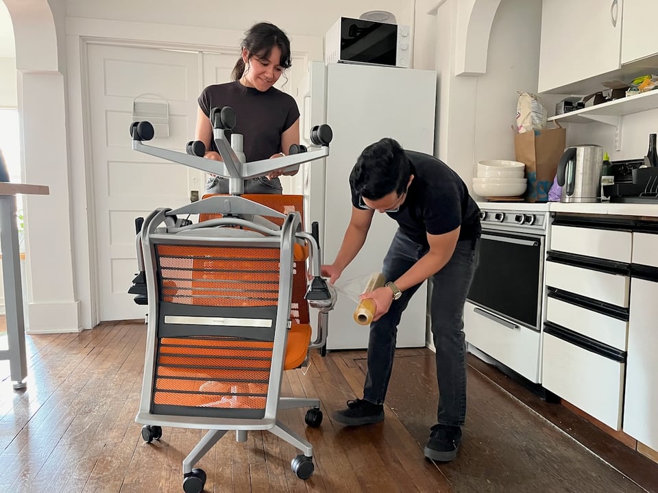 Two people allegedly storing chairs.
