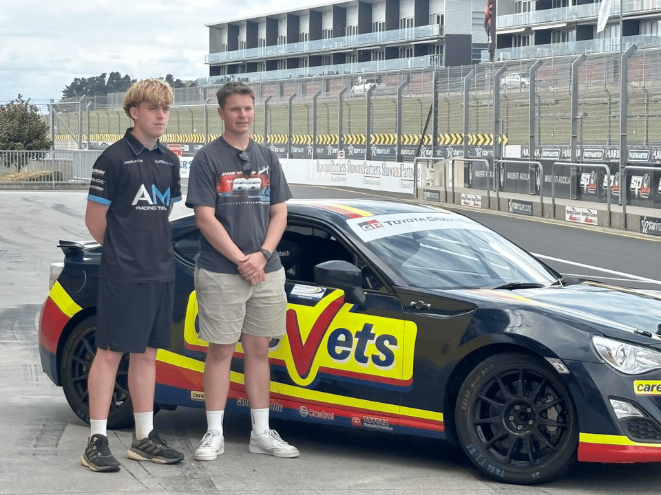 Cooper Prout in front of the CareVets Toyota 86 at the scholarship day