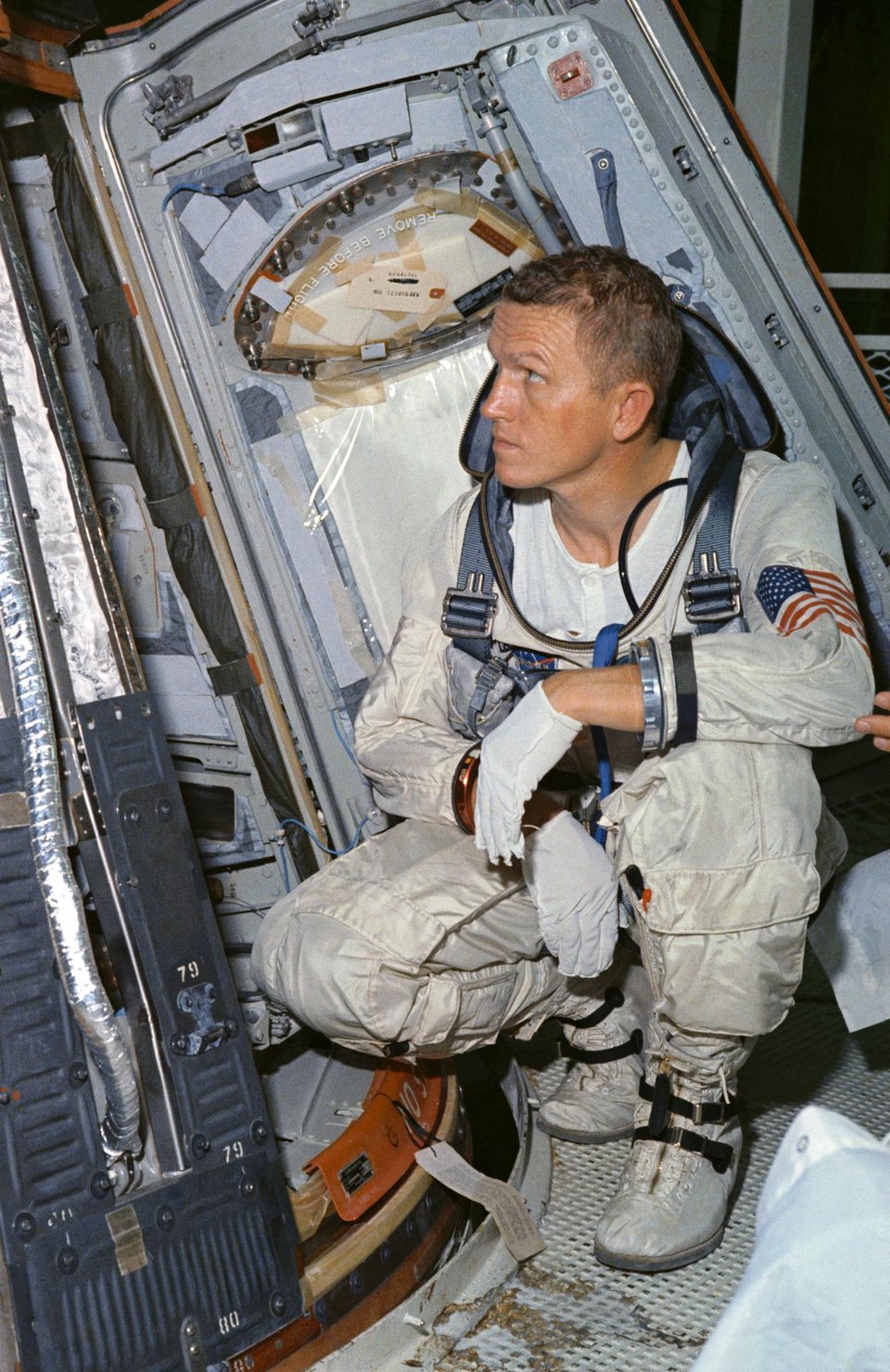 Astronaut Frank Borman inspecting the Apollo command module sometime before the launch of Apollo 8