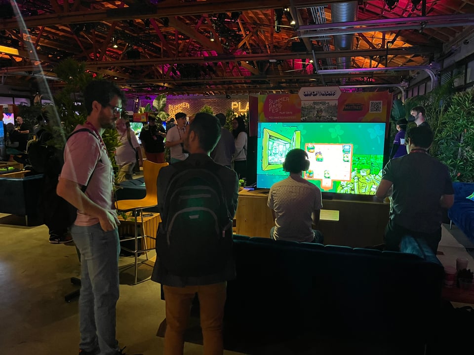 A view of the Summer Games Fest HQ room, with Arranger shown on a big TV