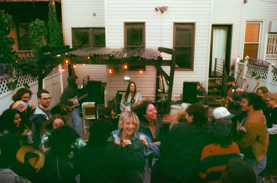 Crowd moshes while Taylor Pearlstein sings a cover of Maps