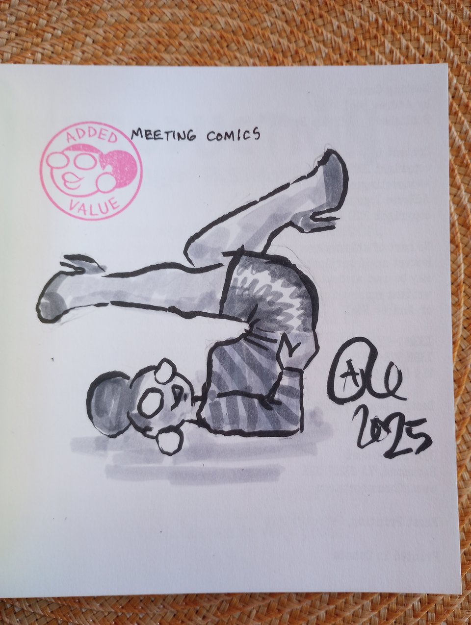 A drawing of Val inside a copy of Meeting Comics.