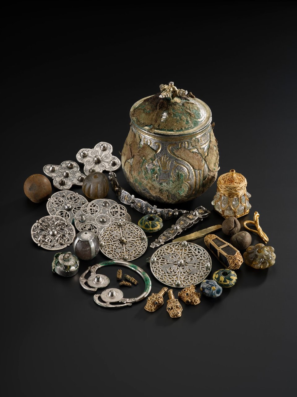 press release image of the silver vessel with precious objects that were found in side, including silver and rock crystal and some gold