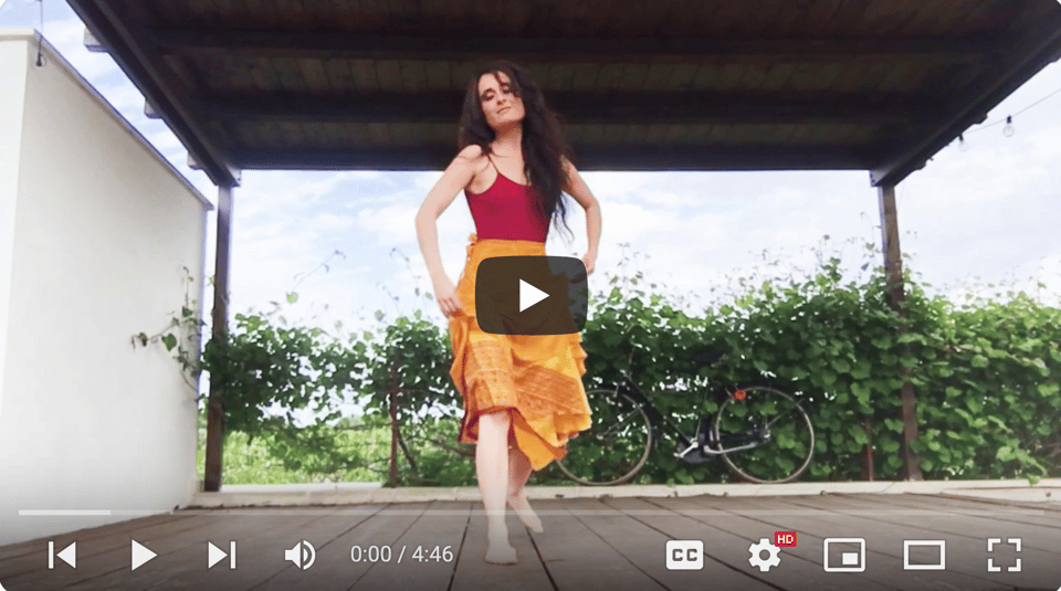 A still from a video with a person dancing
