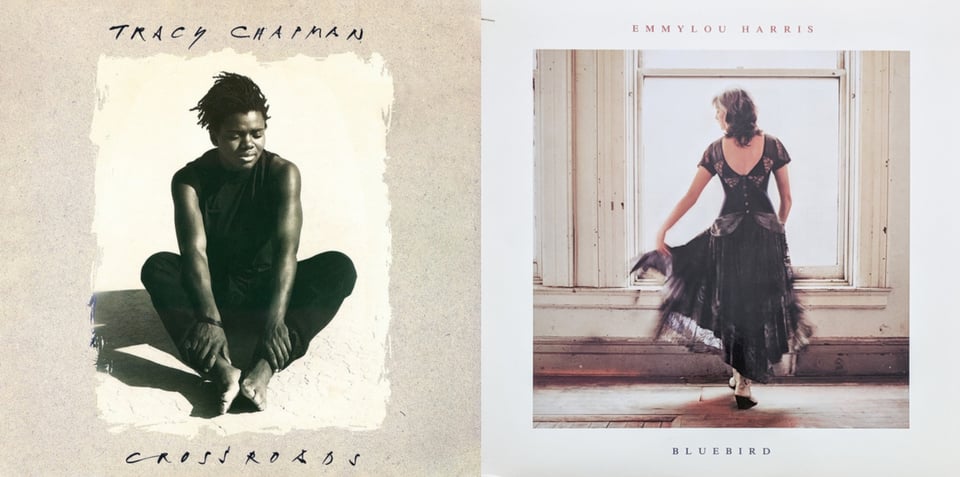 First pic: A slightly sepia-toned photo of Tracy Chapman, a young Black woman with short dreadlocks, sittng on sand. She holds her ankles. She wears a sleeveless black shirt, black pants, and is barefoot. Her eyes are closed, as if thinking hard or maybe just really really experiencing the sun reflecting on her. Second pic: Emmylou Harris, a white woman with dark hair and grey streaks, in front of a large window in a room, her back turned to us. The window is solid white from the light. She wears a dark, possibly purple dress with an open back. She holds out part of her skirt with her left hand, her head turned to look at it. She wears white boots. The walls and floor of the room suggest an old house in need of repair.
