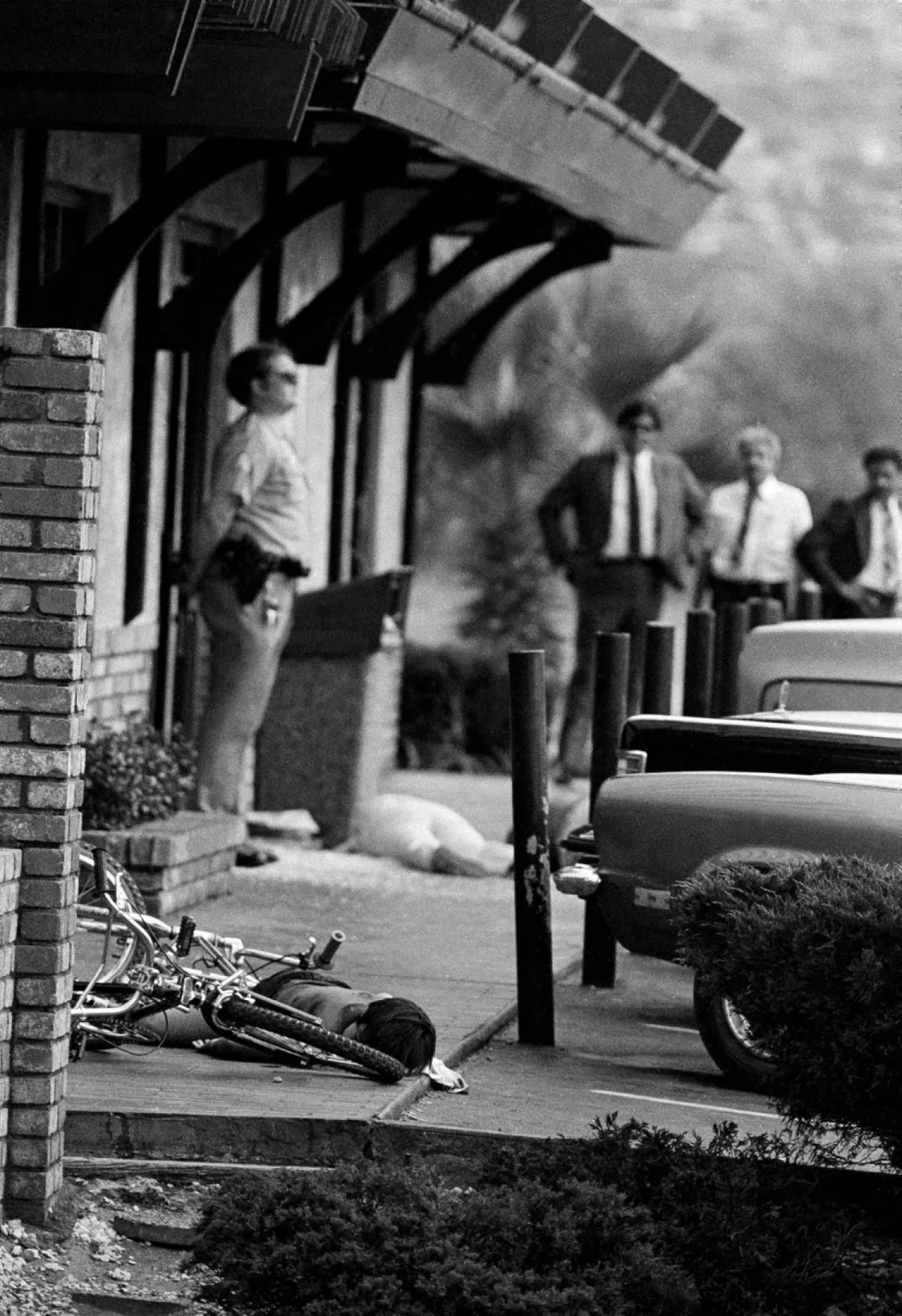 A boy lies dead by his bike as other victims lie outside a San Ysidro McDonald's, July 18, 1984, after a gunman killed at least 20 and wounded a dozen.