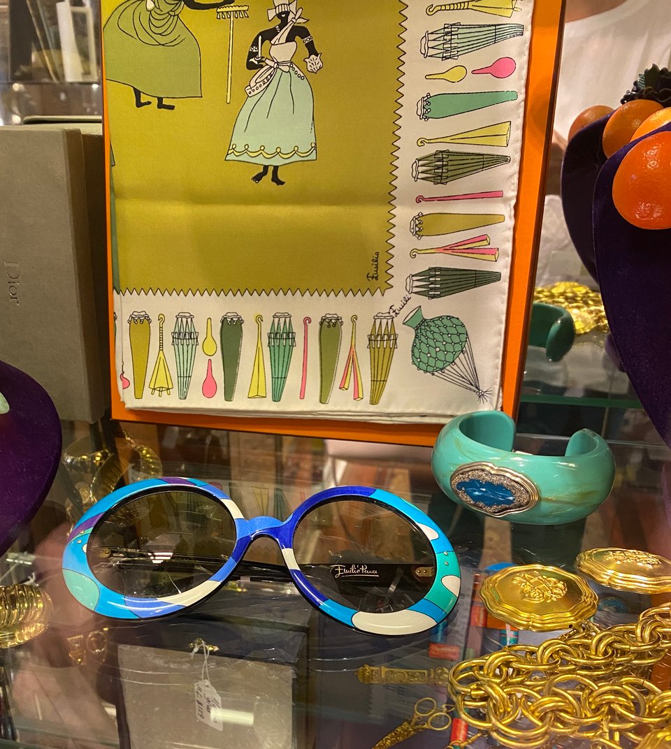 vintage Pucci sunglasses and scarf in a case in an antique store