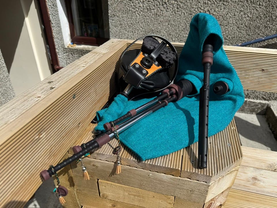 A chanter made from recovered fishing-gear plastic, photographed on the Orkney shore