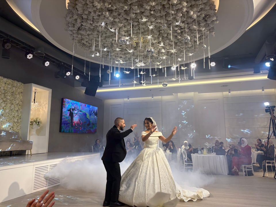 The bride and groom dancing on the dance floor